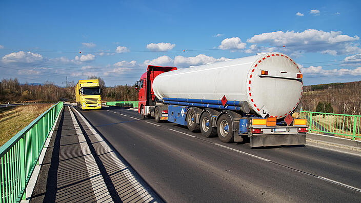 Tanker transporting fuel driving across the bridge