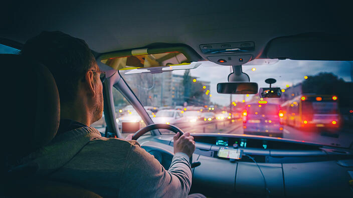  Driving a car in the city at night in traffic jams