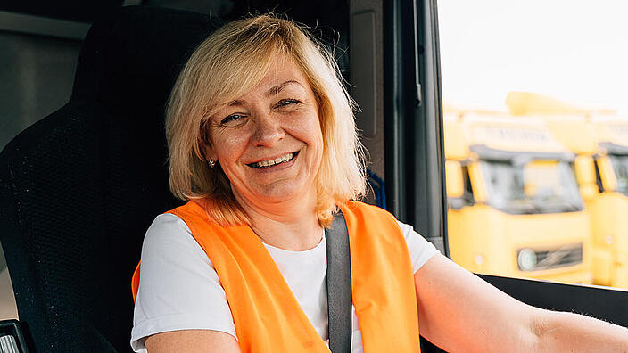 Happy middle age female trucker portrait